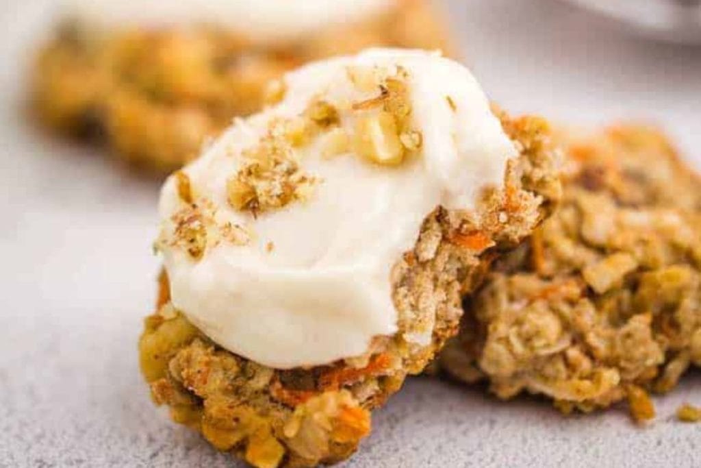 Spring carrot cake cookie with creamy frosting on top.
